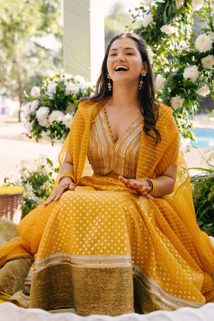 Medha & Beej in Mira Lehanga & Sunflower Kurta set