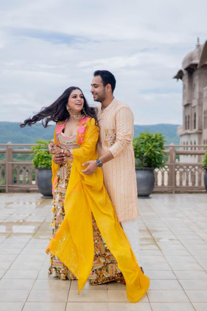 Minal & Nitin In Akira Sitara Yellow set and Peach Plum Mens set