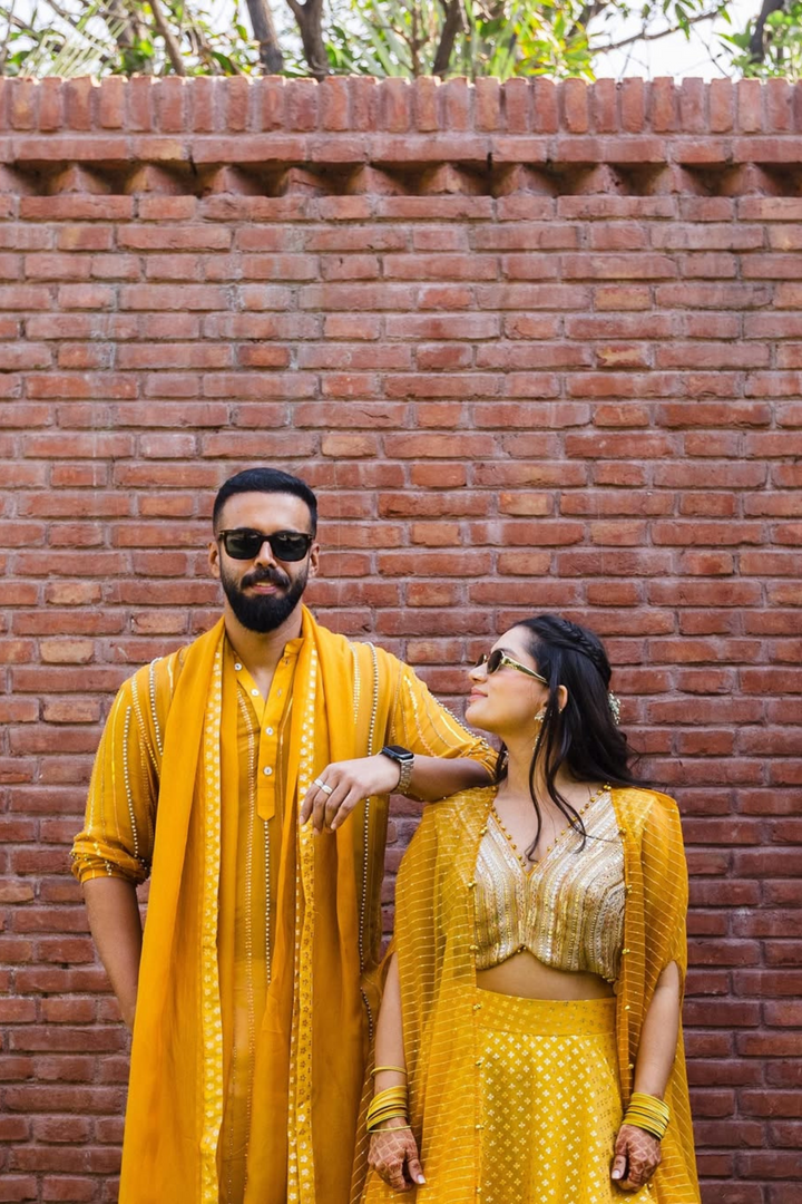Medha & Beej in Mira Lehanga & Sunflower Kurta set