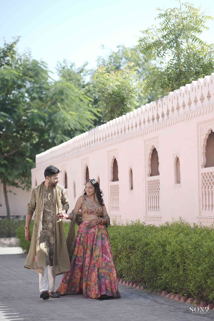 Pavani & Rishabh in Dhoom tana Lehenga & Olive mens Glam Kurta