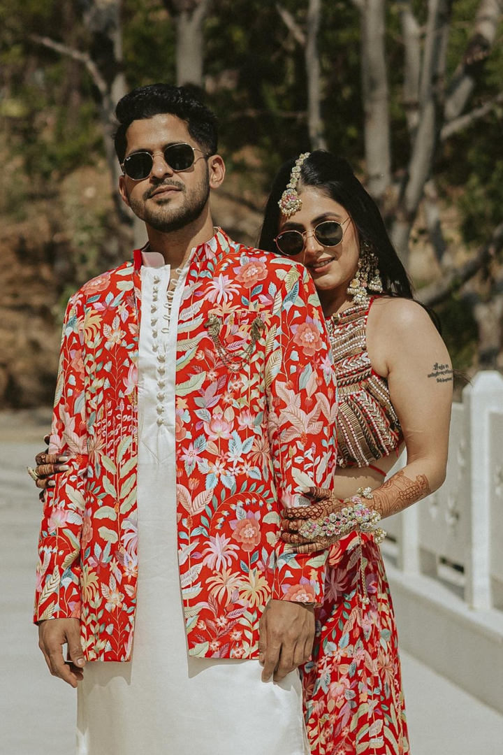 Amrita & Jackie in Paprika Lehanga set and Paprika mens set